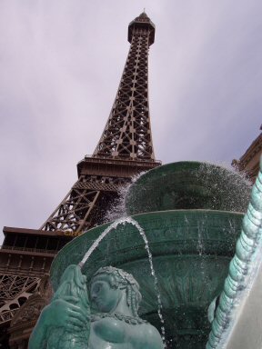 art photo of paris hotel, las vegas, looking up past fountain at the eiffel tower