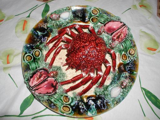 Pallisy ware plate with a red crab on a green sea background