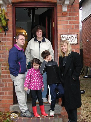 Family standing on stoop in Birmingham, England