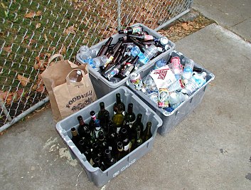 bottles and cans in recyling boxes after the halloween party