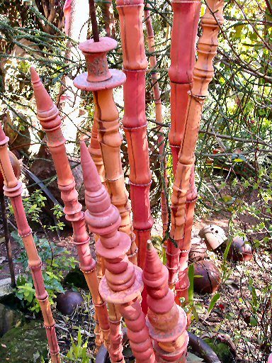 art back yard in berkeley california showing pink ceramic bamboo sculpture