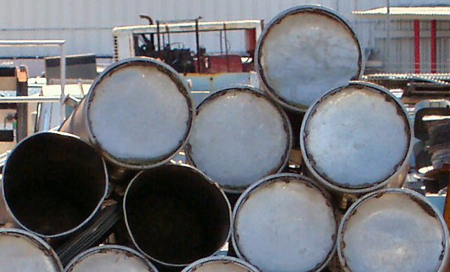 end view of 55-gallon drums stacked up