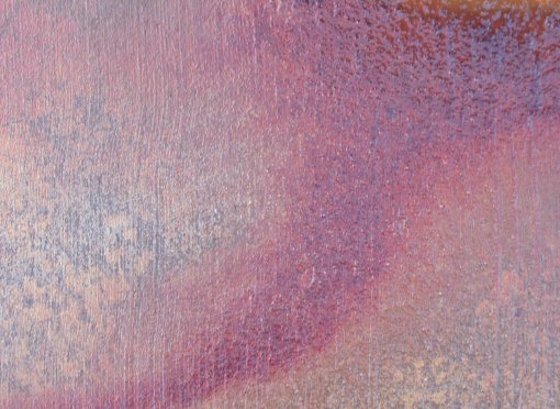 abstract of rust red and blues on a striated bed of grey