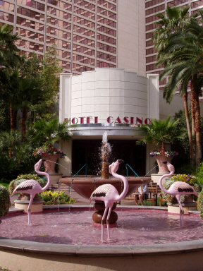 flamingo hotel entry with models of flamingos in a pool