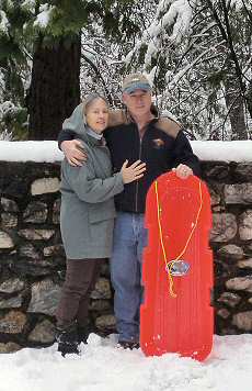bob and carolyn with red sled