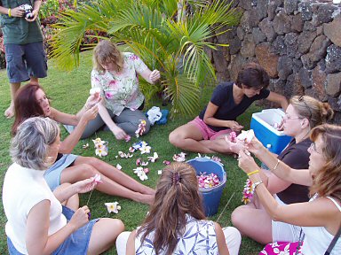 women making leis on kauai