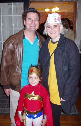 parents with daughter in Wonder Woman costume