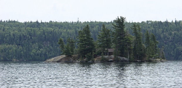 Cabin on an island in the middle of the lake. Isolated.
