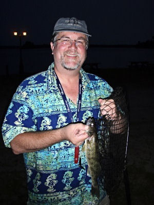 Jim holding a 12 inch walleye