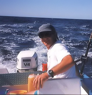 Dave Ravizza sitting in a skiff fishing for tuna